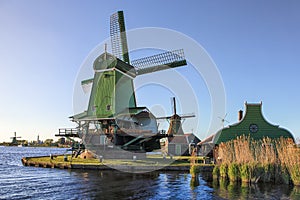 Dutch Windmills at the Zaan River in Zaanse Schans, Holland, The Netherlands photo