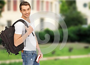 Travelling student with backpack and book