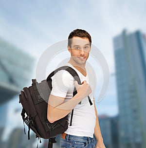 Travelling student with backpack outdoor