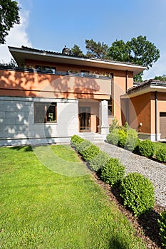 Travertine house at afternoon sun photo