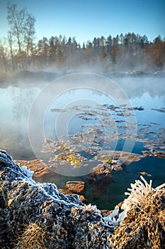Travertine lake with hot water in winter,
