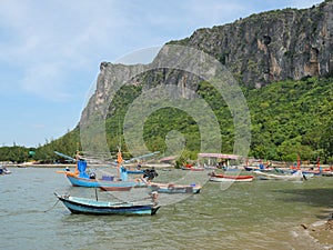 Trawler and Fishing boat at sea with mountain with bridge