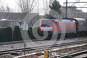 Traxx locomotive with cargo coaches train at the trainstation of Den Haag Laan van NOI in the Netherlands.