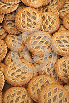 A tray of apple tarts in criss cross pastry. photo