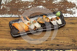 Tray of assorted nigiri and gunkan Norwegian salmon sushi, butterfish nigiri