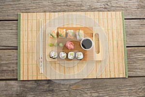 Tray of assorted sushi kept on mat