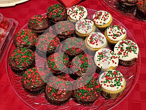 Chocolate and vanilla cupcakes with red and green sprinkles