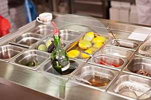 Tray with cooked food on showcase at cafeteria