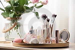 Tray with different makeup products and accessories