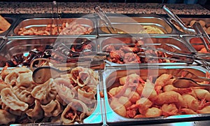 Tray filled with food inside the self service Chinese restaurant