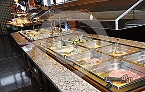 Tray filled with food inside the self service Chinese restaurant