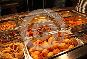 Tray filled with fried meat and fish within the self service res