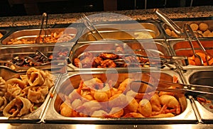 Tray filled with fried meat and fish within the self service res