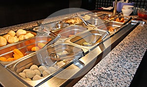 Tray with food inside the self service Chinese restaurant