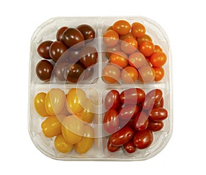 Tray with four variety of fresh tasty mini greenhouse tomatoes