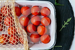 Tray with fresh cherry tomatoes. Organic food.