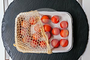 Tray with fresh cherry tomatoes. Organic food.