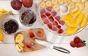 Tray of Fruit Being Prepared to Dehydrate on a Wooden Table