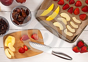Tray of Fruit Being Prepared to Dehydrate on a Wooden Table