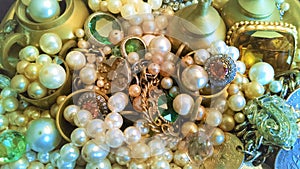 Tray of glassy, brassy, jewels and baubles shine