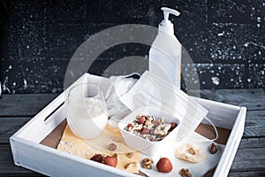 tray with healthy muesli, oat milk and hygiene products for Covid-19