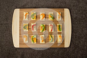 Tray of neatly arranged snacks on crackers