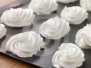 Tray of piped Meringues photo