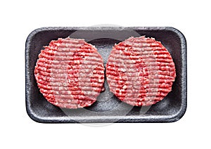 Tray with raw beed burgers isolated