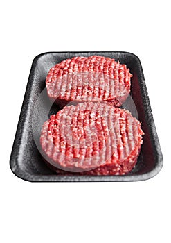 Tray with raw beed burgers isolated