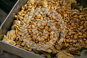 Tray with roasted corn in Peru to accompany traditional Peruvian dishes such as ceviche or rice with seafood.
