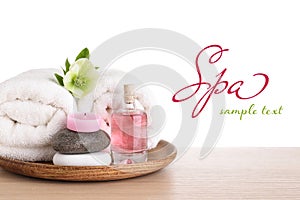 Tray with spa supplies on wooden table against white background. Design with space for text