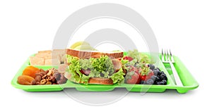 Tray with tasty food on white background. School lunch