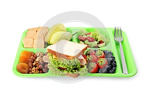 Tray with tasty food on white background. School lunch