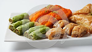 A tray of Turkish pastries including baklava, knafeh -  a Middle Eastern cheese pastry soaked in sweet, sugar-based syrup