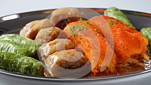 A tray of Turkish pastries including baklava, knafeh -  a Middle Eastern cheese pastry soaked in sweet, sugar-based syrup