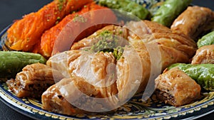 A tray of Turkish pastries including baklava, knafeh -  a Middle Eastern cheese pastry soaked in sweet, sugar-based syrup