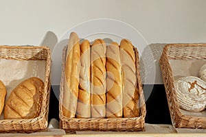 Trays with different breads on shelf
