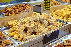 Trays of Golden Fried Chicken at a Food Market