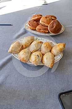 trays of Nigerian Meat pie and doughnuts ready to eat