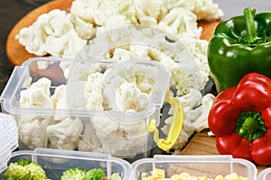 Trays with raw cauliflower for freezing