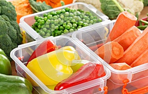 Trays with raw vegetables for freezing.