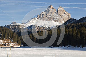 Tre Cime di Lavaredo peaks seen from Misurina lake in Dolomites, Italy in winter, Belluno, Trentino Alto Adige