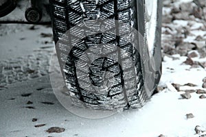 Tread blocks of winter tire packed with the snow