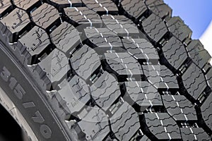 Tread of a new car tire for a truck close-up. New tires. Road safety