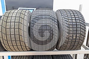 Tread pattern on large rubber speedway tyres in the pit area before a race