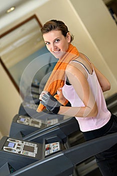 Treadmill Woman with Orange Towel
