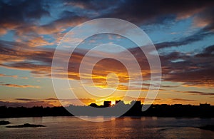 Trearddur bay Sunrise with the sun rising over Snowdonia National Park North Wales