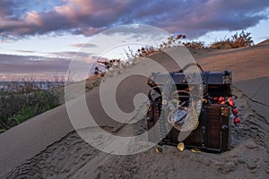 Treasure chest at the beach in a sunrise