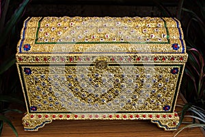 Treasure chest gold on the table. Thai gold treasure chest. Treasure box