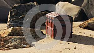 treasure chest in sand dunes on a beach